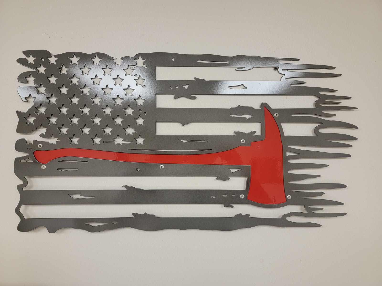 Tattered fire axe flag sign laser cut from steel by LSE Manufacturing